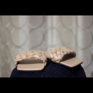 Braided style slide on slipper.